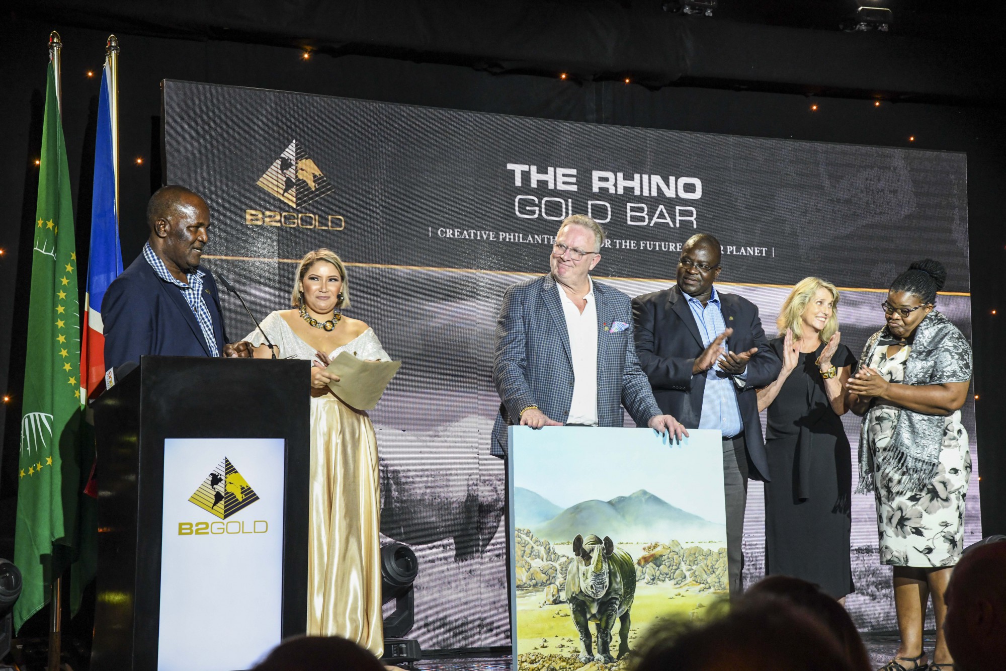 Members of Save the Rhino Trust and integrated rural development and nature conservation present a token of their appreciation to Clive Johnson. From left to right: Simson Uri-Khob, Clive Johnson, John Kasaona, Ginger Mauney, and Maxi Louis.